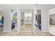 Hallway with a view of the walk-in closet and bathroom at 1810 Pine Hill Dr, Safety Harbor, FL 34695