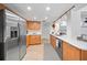 Spacious kitchen with stainless steel refrigerator, ample counter space, and stylish cabinets at 1810 Pine Hill Dr, Safety Harbor, FL 34695