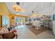 Bright living room with modern decor and sliding glass door access to pool at 1810 Pine Hill Dr, Safety Harbor, FL 34695