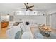 Bright living room with stylish furniture, ceiling fan, and tasteful decor at 1810 Pine Hill Dr, Safety Harbor, FL 34695