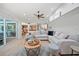 Spacious and stylish living room with a sectional sofa, view of the kitchen, and elegant decor at 1810 Pine Hill Dr, Safety Harbor, FL 34695
