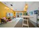 Stylishly staged living room with trendy decor and sliding door to patio at 1810 Pine Hill Dr, Safety Harbor, FL 34695