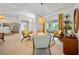 Open living area with seating, bar, pendant lighting, and natural light at 1810 Pine Hill Dr, Safety Harbor, FL 34695