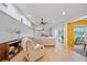 Bright living room with natural light, skylights, modern furniture, and wood flooring at 1810 Pine Hill Dr, Safety Harbor, FL 34695