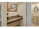 Hallway desk area featuring granite countertop and framed artwork that enhances the design at 19309 Prairie Tree Pl, Tampa, FL 33647