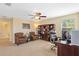 Well-furnished home office area, featuring bookshelves, plus a large window that illuminates the room at 19309 Prairie Tree Pl, Tampa, FL 33647