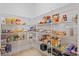Walk-in pantry featuring white wire shelving and plenty of storage space for food and supplies at 19309 Prairie Tree Pl, Tampa, FL 33647
