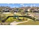 Community playground area with modern play equipment, a picnic shelter, and surrounding landscaping at 19309 Prairie Tree Pl, Tampa, FL 33647