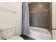 Bathroom features modern tile surround, a shower and blue curtain at 200 Country Club Dr # 308, Largo, FL 33771