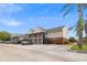 Apartment building with stairs and car park on a beautiful sunny day at 200 Country Club Dr # 308, Largo, FL 33771