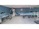 Modern fitness center featuring treadmills, stationary bikes, and weight machines on a gray carpeted floor at 200 Country Club Dr # 308, Largo, FL 33771