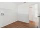 Neat laundry room boasts wood-look flooring, storage shelving, and a convenient washer hookup at 200 Country Club Dr # 308, Largo, FL 33771