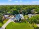 Beautiful aerial view of home with mature trees, well manicured lawn, and a charming exterior at 22304 Stillwood Dr, Land O Lakes, FL 34639