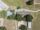 Aerial view showcasing horse infrastructure including barns, paddocks and riding arenas at 22304 Stillwood Dr, Land O Lakes, FL 34639