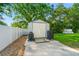 Backyard featuring a utility shed, lush landscaping, and a fenced yard at 22304 Stillwood Dr, Land O Lakes, FL 34639