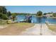 Lake boat ramp with a covered dock, and channel markers and safety instructions at 22304 Stillwood Dr, Land O Lakes, FL 34639