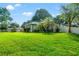 Well maintained lawn and bushes, and a concrete driveway leading to the attached garage at 22304 Stillwood Dr, Land O Lakes, FL 34639