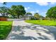 Lovely curb appeal with a concrete driveway, manicured lawn and beautiful exterior at 22304 Stillwood Dr, Land O Lakes, FL 34639