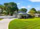 Well-maintained home featuring a lush green lawn, inviting curb appeal, and a charming, paved driveway at 22304 Stillwood Dr, Land O Lakes, FL 34639