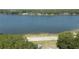 Panoramic view of the lake with sandy shores and lush greenery, perfect for nature lovers at 22304 Stillwood Dr, Land O Lakes, FL 34639