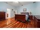 Spacious bedroom with wood floors, walk-in closet, and ensuite bathroom for ultimate privacy and relaxation at 22304 Stillwood Dr, Land O Lakes, FL 34639