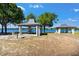 Lakeside picnic area featuring shaded gazebos, grills, and scenic waterfront views at 22304 Stillwood Dr, Land O Lakes, FL 34639