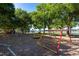 Fun playground with play structures and waterfront in the background at 22304 Stillwood Dr, Land O Lakes, FL 34639