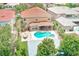 Backyard aerial view of an in-ground swimming pool and hot tub with ample patio furniture at 2300 Hannah S Way, Dunedin, FL 34698