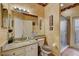 Nice bathroom offers a vanity, decorative mirror, and a glass-enclosed shower at 2300 Hannah S Way, Dunedin, FL 34698