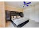 Bedroom features a ceiling fan, built-in storage, and a large closet at 2300 Hannah S Way, Dunedin, FL 34698