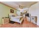A large bedroom with a ceiling fan and built in dressers at 2300 Hannah S Way, Dunedin, FL 34698