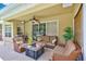 Covered patio with comfortable seating and outdoor grill at 2300 Hannah S Way, Dunedin, FL 34698