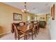 View of dining room with wooden table and comfortable upholstered chairs at 2300 Hannah S Way, Dunedin, FL 34698