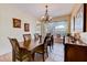 Dining room with wooden table, seating for six, and window views at 2300 Hannah S Way, Dunedin, FL 34698