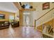 Inviting foyer with tile flooring, decorative accents, and a staircase leading to the upper level at 2300 Hannah S Way, Dunedin, FL 34698