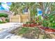 Charming two-story home with a three-car garage and beautiful mature landscaping at 2300 Hannah S Way, Dunedin, FL 34698