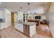Open kitchen concept with stainless steel dishwasher and bar stool seating at 2300 Hannah S Way, Dunedin, FL 34698
