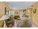 Open concept living room featuring earth-toned walls and a view of the staircase at 2300 Hannah S Way, Dunedin, FL 34698