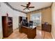 Inviting office space features a ceiling fan, natural light, and wood-style floors at 2300 Hannah S Way, Dunedin, FL 34698