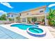 Backyard oasis showcasing a sparkling pool, jacuzzi, covered patio, and outdoor seating at 2300 Hannah S Way, Dunedin, FL 34698