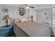 Cozy bedroom featuring a nautical theme with decorative ship and wheel at 2331 Belleair Rd # 214, Clearwater, FL 33764