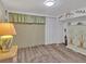Bedroom with wood floors, closet, cabinet and beach-themed decor at 2331 Belleair Rd # 214, Clearwater, FL 33764