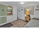 Bedroom featuring hardwood floors, built-in storage, and beach-themed artwork at 2331 Belleair Rd # 214, Clearwater, FL 33764
