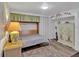 Bedroom with hardwood floors, cabinets, and a comfortable murphy bed at 2331 Belleair Rd # 214, Clearwater, FL 33764