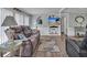 Cozy living room features comfortable seating, stylish decor, and plenty of natural light at 2331 Belleair Rd # 214, Clearwater, FL 33764