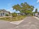 Picturesque neighborhood street view showcasing manicured landscaping, trees, and inviting homes at 2331 Belleair Rd # 214, Clearwater, FL 33764