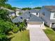 Beautiful two-story home featuring a spacious two-car garage and lush tropical landscaping enhancing its curb appeal at 2510 Cross More St, Valrico, FL 33594
