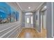 Bright foyer with beautiful artwork, elegant trim, and gleaming hardwood floors at 2510 Cross More St, Valrico, FL 33594