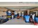 Well-organized garage featuring plenty of storage and a parked motorcycle at 2510 Cross More St, Valrico, FL 33594