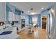 Bright kitchen features blue walls, white cabinets, stainless steel appliances, and a functional island at 2510 Cross More St, Valrico, FL 33594